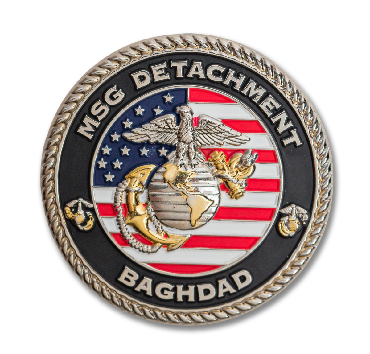 Coin with 'MSG Detachment Baghdad' text and American flag design on a white background