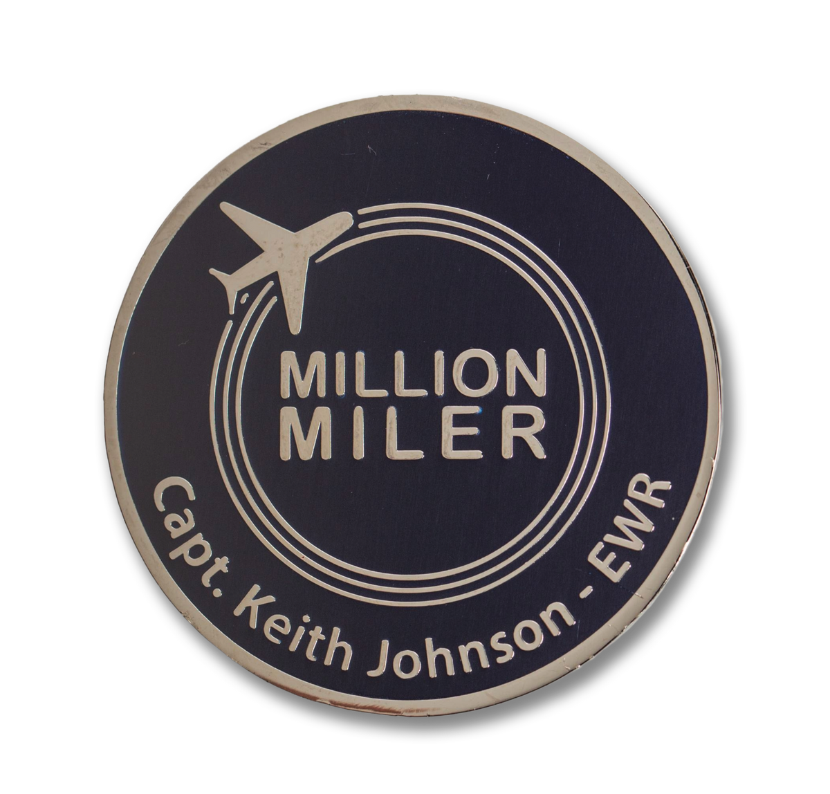 Round 'Million Miler' badge with airplane icon on a white background